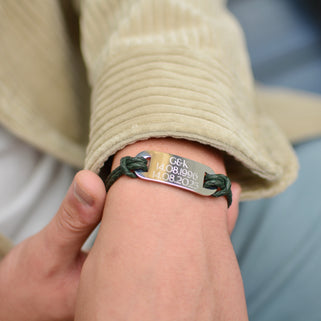 Men's Personalised Double Strand Leather ID Plate Bracelet shown close up on model with engraving and green leather option