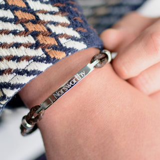 Personalised Men's Leather Slim Bar Bracelet shown in brown leather close up on model.