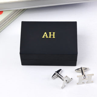 Personalised alphabet cufflinks in "A" and "H" with black cufflink box personalised with "AH" monogrammed in gold foil on top of the box