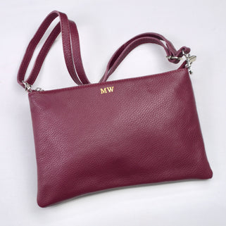 Personalised Monogram Large Leather Clutch Or Crossbody Bag shown in burgundy with strap attached