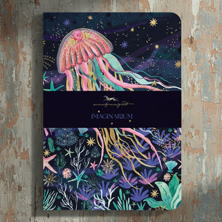 Notebook with jellyfish design on a dark blue background