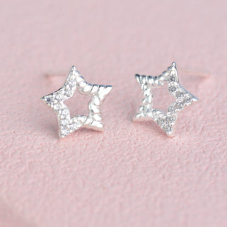 Sterling Silver CZ Open Star Stud Earrings shown close up.