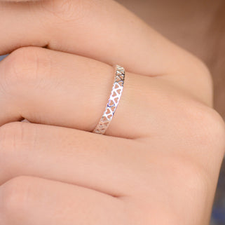 Filigree open Hearts Ring shown close up on model
