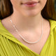 silver chain and pearl bead necklace shown in close up shot on model.