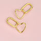 Gold Heart Shape Drop Hoop Earrings shown close up