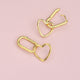 Gold Heart Shape Drop Hoop Earrings shown close up