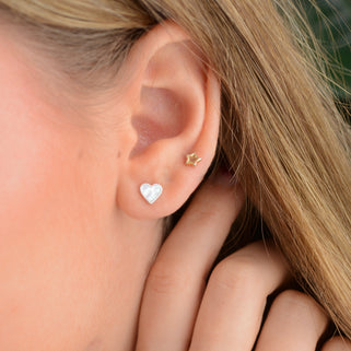 Silver Pearl Heart Studs shown in close up shot on model