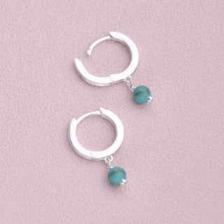 Sterling Silver Turquoise Dangle Huggie Earrings shown close up with hinged detail.