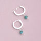Sterling Silver Turquoise Dangle Huggie Earrings shown close up with hinged detail.
