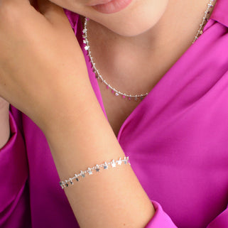 Personalised Mini Silver Star Cluster Bracelet shown close up on model with matching necklace
