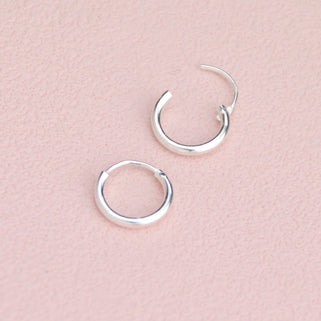 Simple Silver Sleeper Huggie Hoop Earrings  showing hinge detail