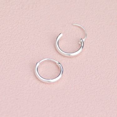 Simple Silver Sleeper Huggie Hoop Earrings  showing hinge detail