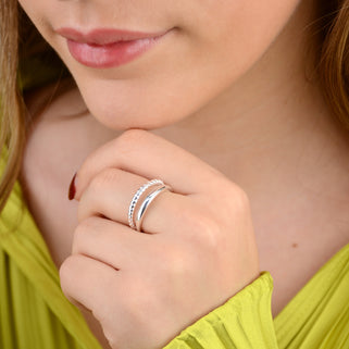 Sterling silver double band ring shown in close up shot on model