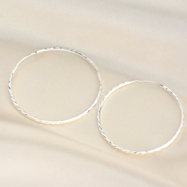 Sterling Silver Large Textured Hoop Earrings shown close up 