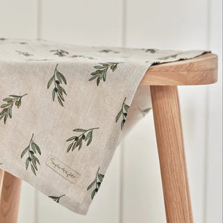 Linen tea towel with green olive branch pattern