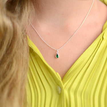 Girl's Sterling Silver Teardrop Birthstone Charm Necklace shown close up on model - May/Emerald birthstone