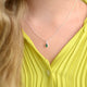 Girl's Sterling Silver Teardrop Birthstone Charm Necklace shown close up on model - May/Emerald birthstone