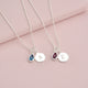 Personalised Silver Girls Initial Teardrop Birthstone Necklace shown close up with December and January Birthstones