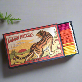 The tiger giant match box, open showing pink, orange and yellow extra long matches. 