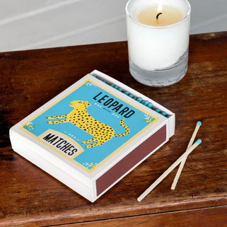 box of oversize long matches with blue tips in a leopard design box