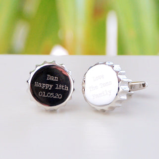 Bottle Top Cufflinks with "Dan Happy 18th 01.05.20" on the left and "Love The Toms Family" Engraved on the right cufflink shown in close up shot