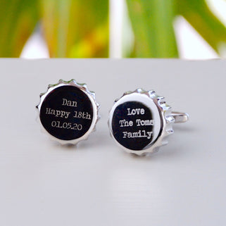 Bottle Top Cufflinks with "Dan Happy 18th 01.05.20" on the left and "Love The Toms Family" Engraved on the right cufflink shown in close up shot