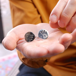 Round Silver Cufflinks, left one with handprint engraved and right one with "Best Daddy, like, EVER! Love Joe xxx" Engraved shown in close up shot