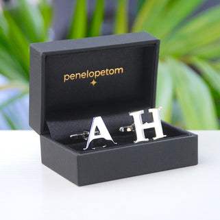 Personalised alphabet cufflinks in "A" and "H" in black penelopetom cufflinks box