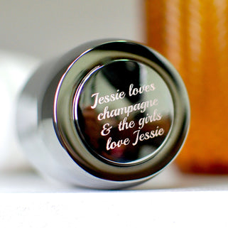 Silver Champagne Or Prosecco Bottle Stopper with "Jessie loves champagne & the girls love Jessie" message engraved shown in close up shot
