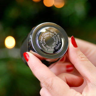 Prosecco stopper with personalised spiral message shown in close up with model