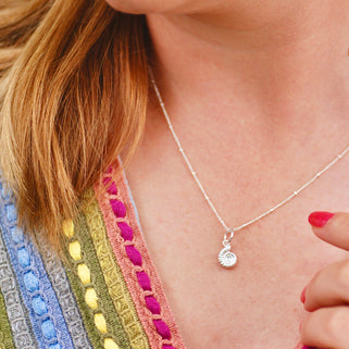 Sterling Silver Ammonite Charm on satellite chain necklace shown on close up of model