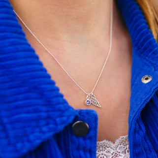 Sterling Silver Angel Wing and February Amethyst Birthstone Necklace shown on model close up