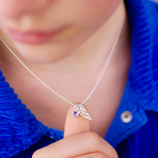 Sterling Silver Angel Wing and February Amethyst Birthstone Necklace shown on model close up