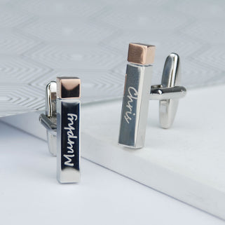 polished silver cuboid shape cufflinks with rose gold tip. 