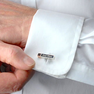 Silver Cuboid Cufflink with rose gold tip and "Best Man" engraved, shown on close up of models white shirt cuff.