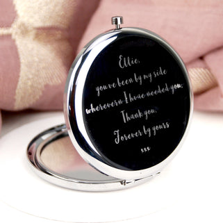 Silver Bridesmaid Compact Mirror with "Ellie, you've been by my side wherever I have needed you, Thank you, Forever by yours xxx" engraved in the centre, shown in close up shot