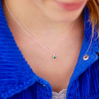 Sterling Silver Mini May Emerald Birthstone Charm Necklace shown on model close up