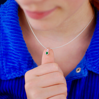 Sterling Silver Mini May Emerald Birthstone Charm Necklace shown on model close up