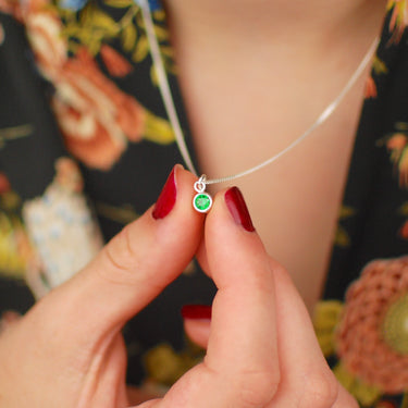 Sterling Silver Mini Emerald/May Birthstone Charm Necklace shown close up on model