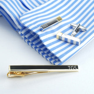 Tie clip and bar cufflink set. Gold tie clip with initials "TGS" engraved on right side and silver bar cufflinks with gold tips with "TGS" engraved at the end of the cufflink