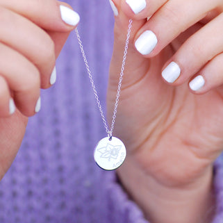 Silver circle disc necklace with March/Daffodil birth flower and "Amelia" engraved
