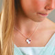 Sterling Silver Star Necklace with Initial C Disc and July Ruby birthstone charm shown close up on model