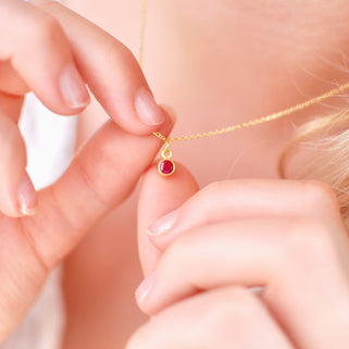 Gold Vermeil Mini Ruby/July Birthstone Charm Necklace shown on model close up