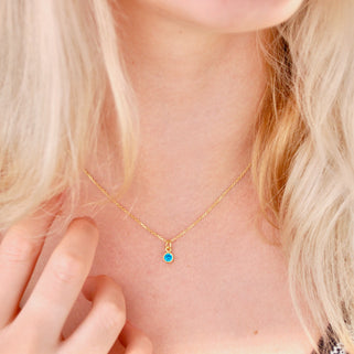 Gold Vermeil Mini Blue Topaz/December Birthstone Charm Necklace shown on model close up