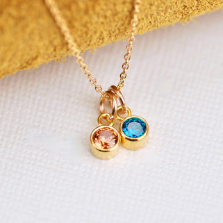 Personalised Gold Family Birthstone Necklace with two birthstones -  December/Blue Topaz and November/Citrine shown close up