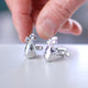 Silver golf club cufflinks shown in close up shot