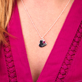 Personalised Heart and Birthstone Necklace with "I Heart U X" Engraved on Silver Heart and October/Tourmaline Birthstone shown close up on model