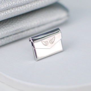 Close up shot of Angel Wing on Envelope Memorial Pin