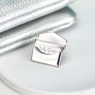 Close up shot of envelope pin open showing part of personalised letter message