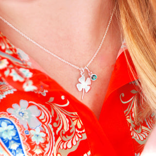 Lucky Clover Charm Necklace with May/Emerald birthstone charm shown on model close up